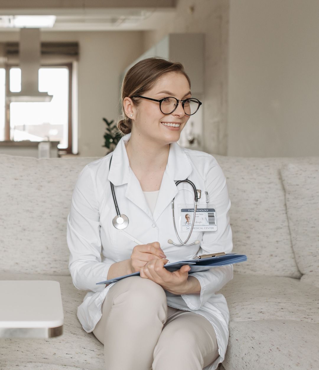A clinician with a stethoscope and clipboard